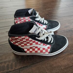 Red ceckered high top Vans